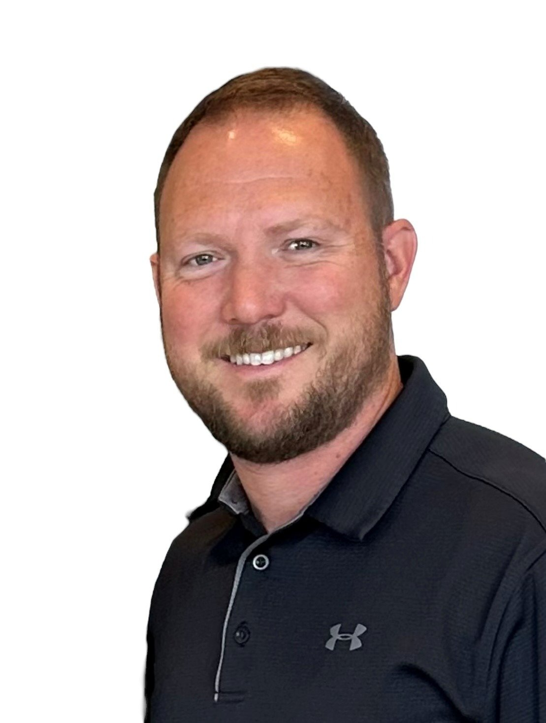 Cedric Lavergne, founder of Vending Business 101, smiling and wearing a black Under Armour polo shirt